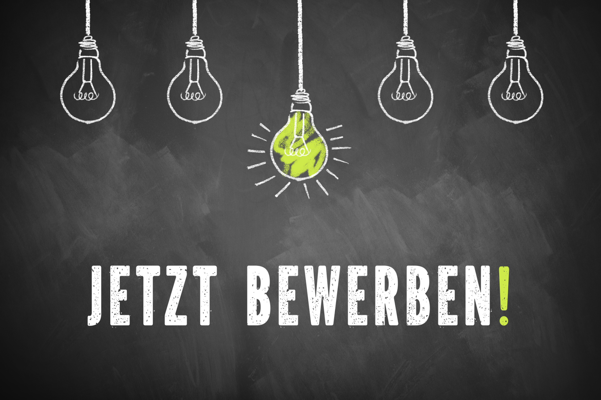 chalk lightbulbs and the message 'Apply Now!' in German on a chalkboard Jetzt bewerben