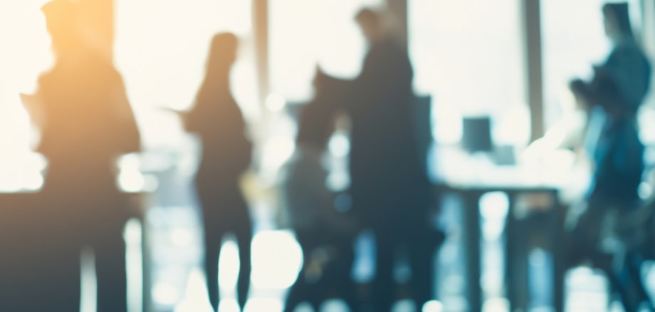 unrecognizable motion blurred business people in an office Abstract office background